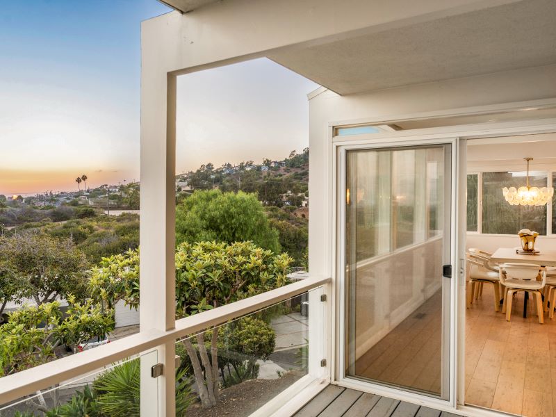 Covered deck beside the dining room, looking out across Ventura toward the coastal horizon
